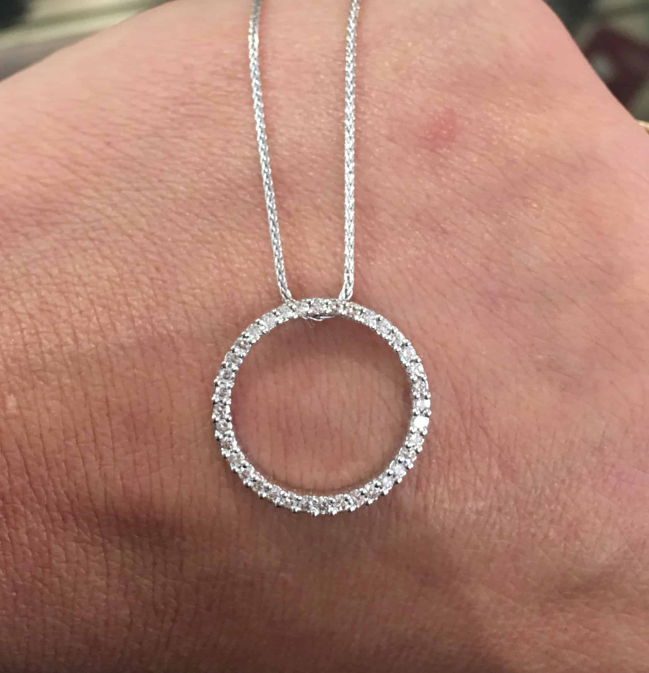 This lovely 14kwg circular diamond pendant is a perfect picture of elegance and simplicity.