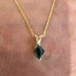 diamond shaped pendant on gold chain